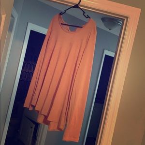 A pink shirt with a lace back